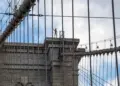 Naked man jumps from Brooklyn Bridge after scaling tower with Kazakhstan flag