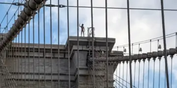 Naked man jumps from Brooklyn Bridge after scaling tower with Kazakhstan flag